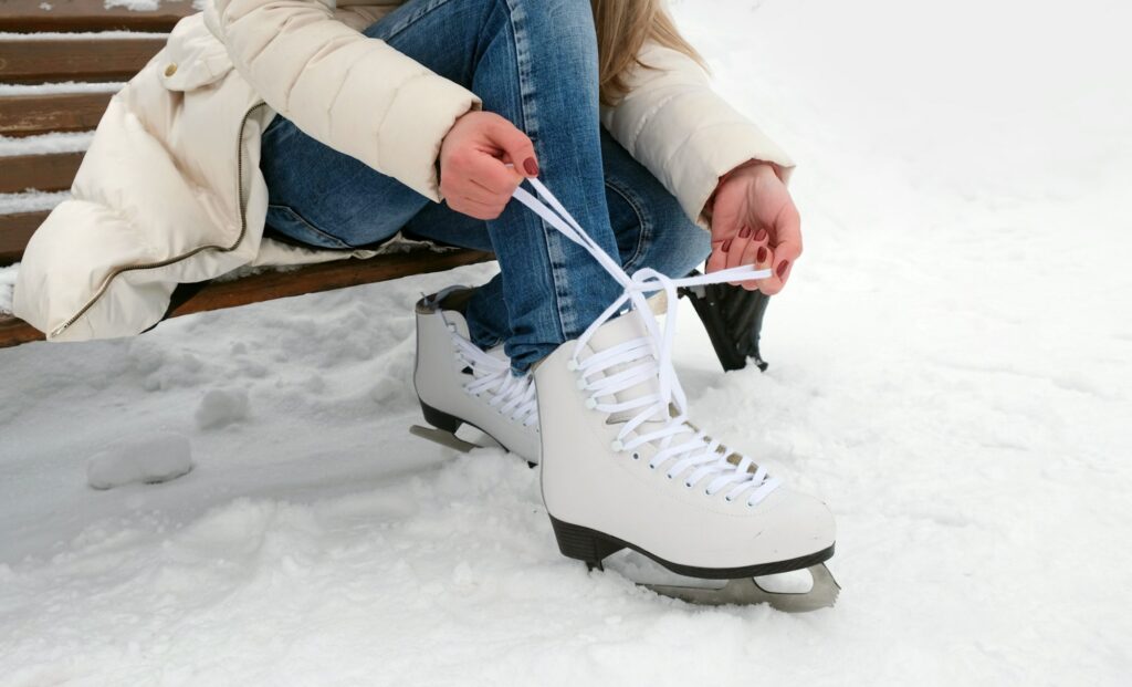 Woman puts on ice skates